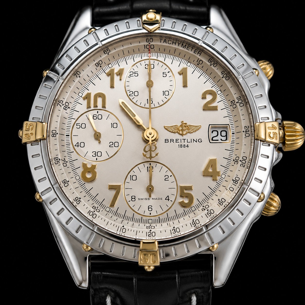 Breitling Chronomat dial showing date display — date mechanism begins engaging around 10:45pm