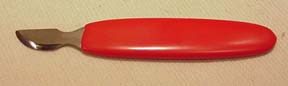 Pocket watch case opening tool — a knurled disc with a rubber pad for unscrewing screw-back cases
