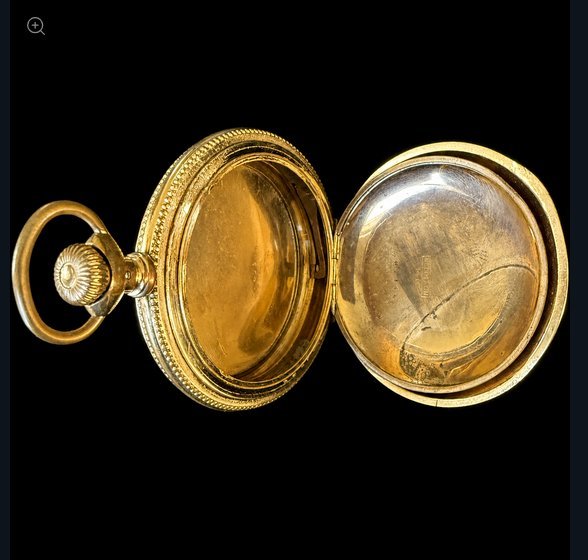 An antique gold hunter pocket watch case opened to show its construction — the hinged front cover and the back case interior, both empty after the movement and dial have been removed