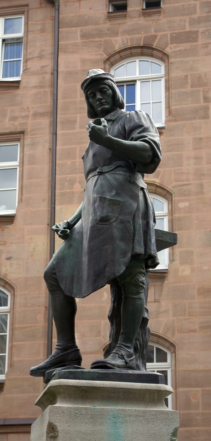 The 1905 Peter Henlein fountain in Nuremberg, the young locksmith holding a watch