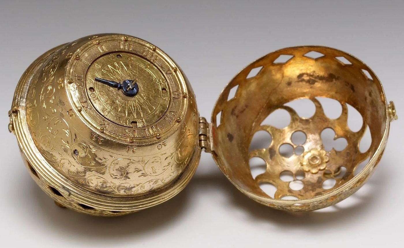 Melanchthon's spherical watch of 1530 open, showing its single hand and pierced cover